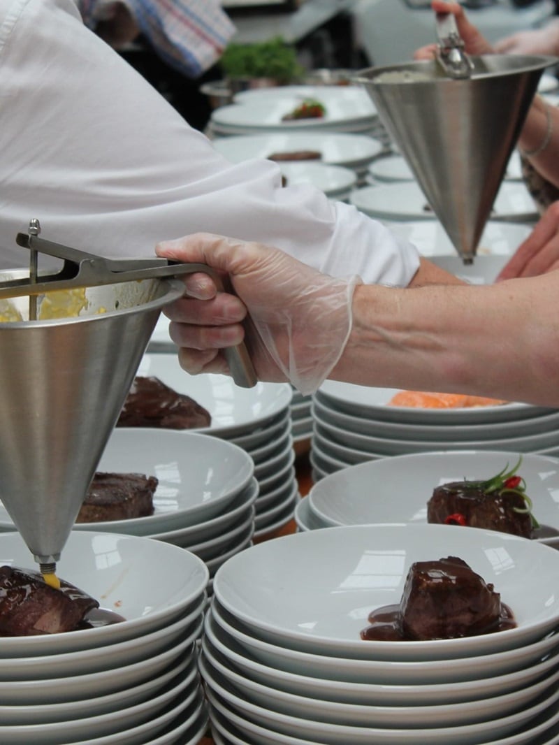 catering crew plating up for a corporate event